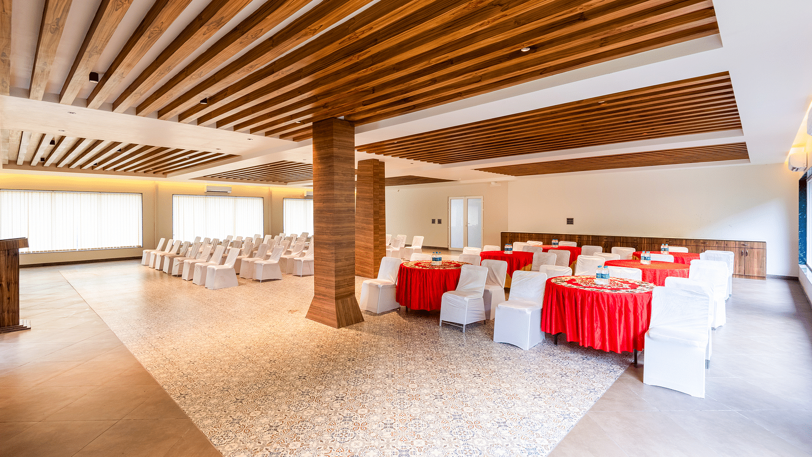 Banquet Hall at DLS Divine River Resort and Spa featuring  chairs table and a stage